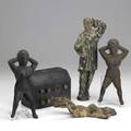 Five pieces of cast iron chest door stop three naughty nelly bootscrapers and one pantomime figurine 18th19th c tallest 13