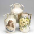 Roseville three creamware urns one painted wth roses one with decal decoration one undecorated each 7 12