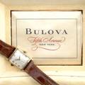 Bulova mens watch gold curved tank watch 21 jewels white engineturned face with subsidiary seconds in original case