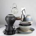 Contemporary craft pottery peter saenger black porcelain tea set and louis vaccaro cylindrical vase together with seven pieces by stephen fabrico including a black vase covered jar two bowls two s