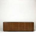 Style of florence knoll walnut credenza with twelve drawers and two doors concealing adjustable shelves backside finished in walnut 27 12 x 89 x 19 12