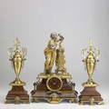 Tiffany  co threepiece french clock set in dore bronze and red marble ca 1900 time and strike with garniture pair dial signed 17 12