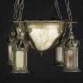 Arts  crafts lighting hanging fixture with half globe and four drops lined in caramel slag glass in patinated metal frame 20th c complete with original chains and ceiling cap unmarked fixture
