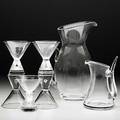 Steuben crystal cocktail grouping includes five trumpetform martini glasses tall pitcher and small pitcher 20th c each engraved steuben tallest 10 14