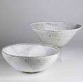 Stephen merritt two large stoneware bowls each in a creamy white glaze each signed taller 15