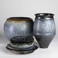Richard aerni six pieces of ash glazed stoneware include handled vase large jardiniere two chargers and two bowls dated 19881990 each signed tallest 16 14 x 10 12 dia