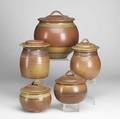Robert crystal five stoneware covered jars four with strap handles three dated 1987 each signed largest 11 x 10 x 10