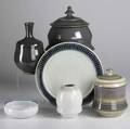 Richard lang six pieces of stoneware include two covered jars charger two vases and a bowl all signed tallest 9