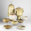 Eric cushing nine pieces of stoneware include a covered urn two covered jars and six bowls all signed tallest 15 x 11 x 9