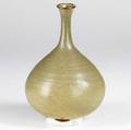Studio pottery porcelain bottleshaped vase with ochre glaze marked with artists cipher 10 x 7