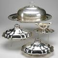 Five pieces of silver plate pair of covered vegetable dishes gravy boat and roast cover on oval tray 20th c largest 10 12