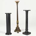 Three wood pedestals one tall with carved base others painted black 20th c tallest 64