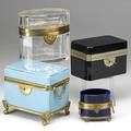 Four glass caskets blue opaline with enamel cobalt blue amethyst and clear glass all metal mounted 19th20th c largest 5 12 x 3 34 x 5