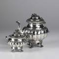 Antique silver partial coffee service coffee pot and covered twohandled sugar bowl half lobed with floral borders finials and hairy paw feet 668 ot 9 12 pot missing handle