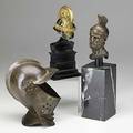 Three bronzes bearded gentleman and two miniature helmets one from a suit of armor 19th20th c tallest 12