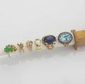 Six gemset gold rings 14k and 18k include opal sapphire blue topaz sherry tourmaline jade ruby citrine and lapis sizes 6 12  12 437 gs gw