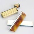 Cartier accessories gold plated lighter marked cartier paris and cartier sterling travel comb
