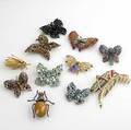 Butterlfy or insect brooches eleven pieces 20th c gold enameled grasshopper by boucherer two sparkler butterflies silver and amber insect weiss jelly belly butterfly regency greenblue butterfly