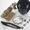 20th c jewelry thirteen pieces include bracelets necklaces ring and tiara in silver silver plate or bronze