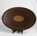 Wooden oval serving tray mahogony with brass handles shell inlaid center 20th c 20 x 19