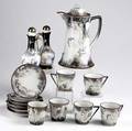 Japanese moriage fifteen piece chocolate set two cups with broken handles together with a pair of cruets all 20th c tallest 9