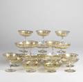 Moser style gilt decorated glass includes twelve matching compotes together with seven champagne saucers and two matching compotes compote 2 14 x 5 14