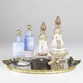 Perfume grouping eleven pieces include bottles trays and boxes oval mirrored tray oval box and painted porcelain plaque pair of enameled blue bottles two pink enameled bottle with matching box p