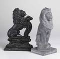 Lion figures two pieces cast iron kneeling lion doorstop together with a lead recumbent lion