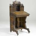 Tramp art desk with lift top and bookcase section applied decoration and fretwork molding across top ca 1900 52 x 26 x 22