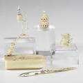 Ivory grouping five pieces include spinning wheel letter opener ashtray and two others largest 4 38 x 2 34