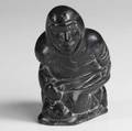 Inuit green soapstone carving of an ice fisherman early to mid 20th c 6