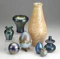 Studio art glass eight pieces include tall vase signed merritt pulled feather vase dated 1989 lundberg vase signed sanderson egg paperweights signed two small vases all 20th c tallest 13 3