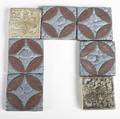 Grueby  batchelder five grueby tiles with circular decoration and leathery glaze together with two batchelder floral tiles grueby tiles 3 x 3