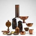 Roycroft metal group seventeen pieces some copper washed and some polished pair of wallhanging candlesticks cylinder vase eight ashtrays compote covered jar wallhanging candlestick two small
