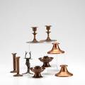 Roycroft metal group nine pieces some hammered copper and some brasswashed three pair candlesticks one candlestick and two bud vases most with orb  cross mark tallest 5