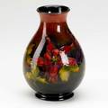 Moorcroft vase decorated in the columbine pattern signed w moorcroft stamped made in england 7 14