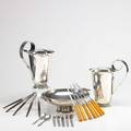 Danish modern silver plate and utensils twentytwo pieces 2 royal hickman water pitchers footed center bowl 7 knives with celluloid handles 5 knives with ebony handles 7 assorted utensil