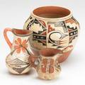 Southwest pottery three pieces redware 20th c vase marked may josa jemez and two pitchers tallest 5 12