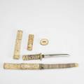 Asian daggers four pieces 20th c carved bone mounted dagger carved bone mounted dagger without sheath extra handle and extra sheath longest 17