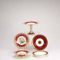 European porcelain thirtyfour pieces twelve 8 38 lobed bowls with partial gilt fuchsia borders and ten 8 34 plates with fuchsia borders and center medallion minton for cilman collamore etc