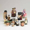 Royal doulton etc twelve pieces 20th c five royal doulton toby mugs sir john falstaff the cavalier winston churchill sam weller long john silver etc tallest 6