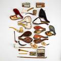 Pipe grouping twentytwo meerschaum 19th20th c amber bowls and stems of nudes horses dogs etc longest 13