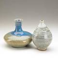 Volkmar harvey littleton two pieces volkmar squat baluster vase with blue to golden crackle glaze together with littleton ovoid shape earthenware vase with matte swirling lines and speckled decorat