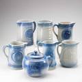 Decorated stoneware seven items 19th20th c boston baked beans pot and six jugs with various decoration tallest 8 12