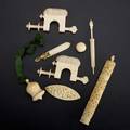 Ivory or bone sewing utensils eight pieces 19th20th c bookmark waxer bellshaped case cylindrical case with implements carved tatting shuttle pair of sewing clamps and parasolshaped needle