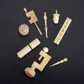 Ivory or bone sewing utensils eight pieces 19th20th c needle case with ebony sewing clamp point with protector acornshaped tape measure small picker carved clamp needle case with faceted s