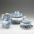 Davenport four assembled pieces of blue and white transferware depicting pastoral or city scenes early 19th c includes soup tureen with ladle sauceboat with underplate and pitcher largest 9 14
