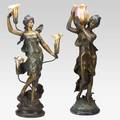 Two bronze figural lamps depicting classical females with foliate gold iridescent art glass shades 20th c taller 35