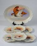 A Set of Seven7 Limoges Plates with Duck Design