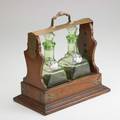 C dorflinger  sons brassmounted oak tantalus with green decanters early 20th c marked 13 12 x 13 14 x 7 12